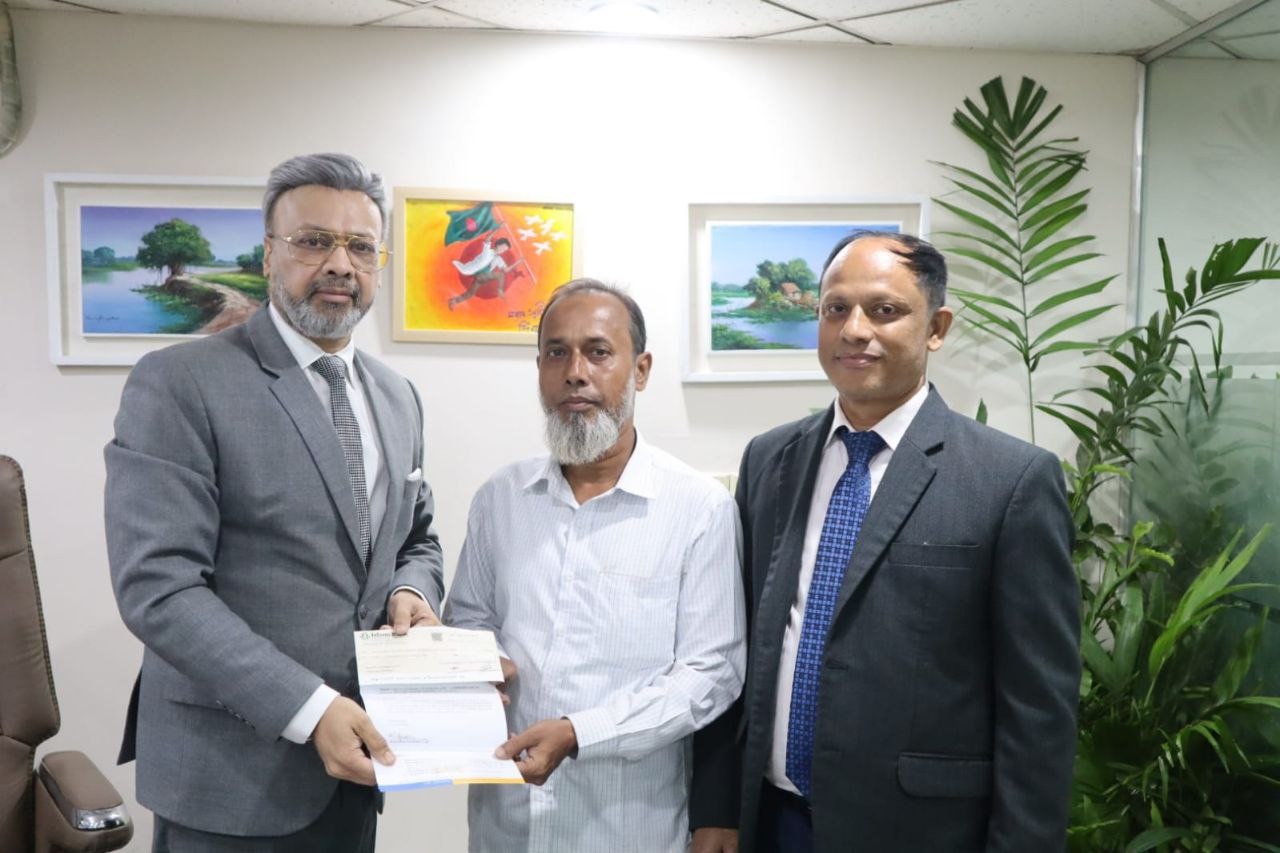 Fire Insurance Claim Cheque Accepted by Honorable Md. Riazul Hasan, Manager, M/S Amin Traders.