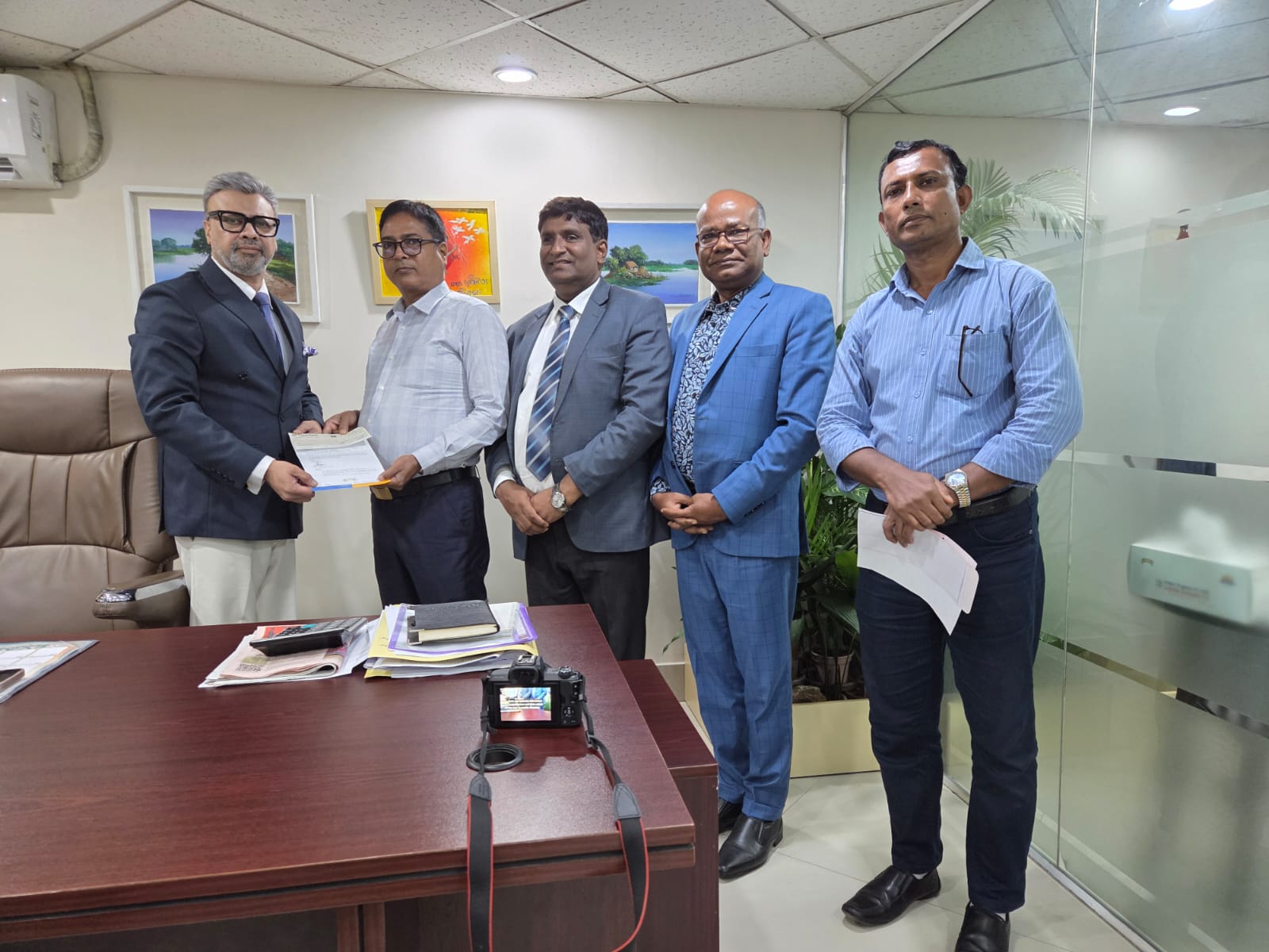 Eastern Insurance PLC officially handed over the claim cheque to the proprietor of Mattri Store, Patuakhali